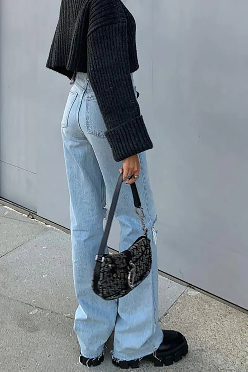Trendy wijde jeans met uitlopende pijpen en gescheurd denim
