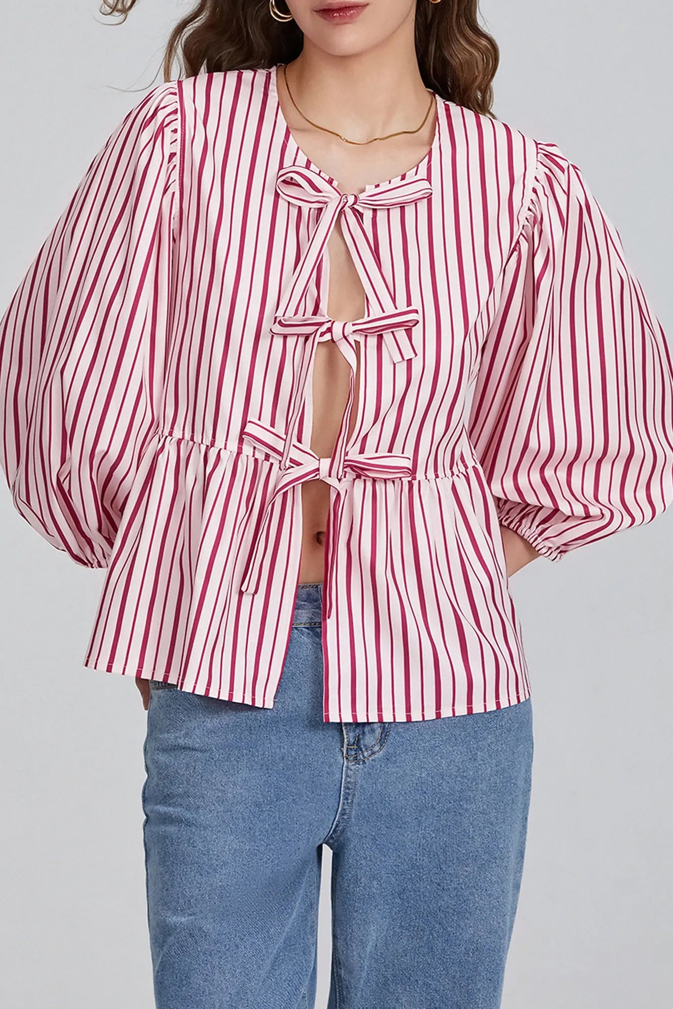 Blouse met pofmouwen, peplum en strik